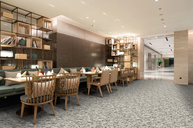 An example of Natura Alder Ornas from Ulster Carpets in a modern room setting 